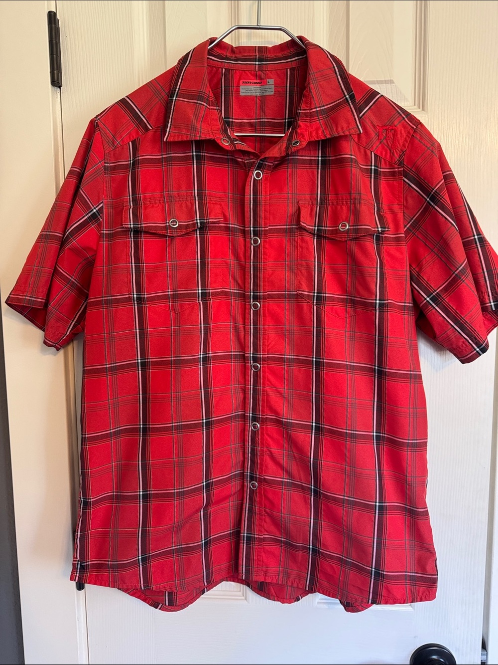 Men’s size Large Novara short sleeved Madris style plaid shirt.
